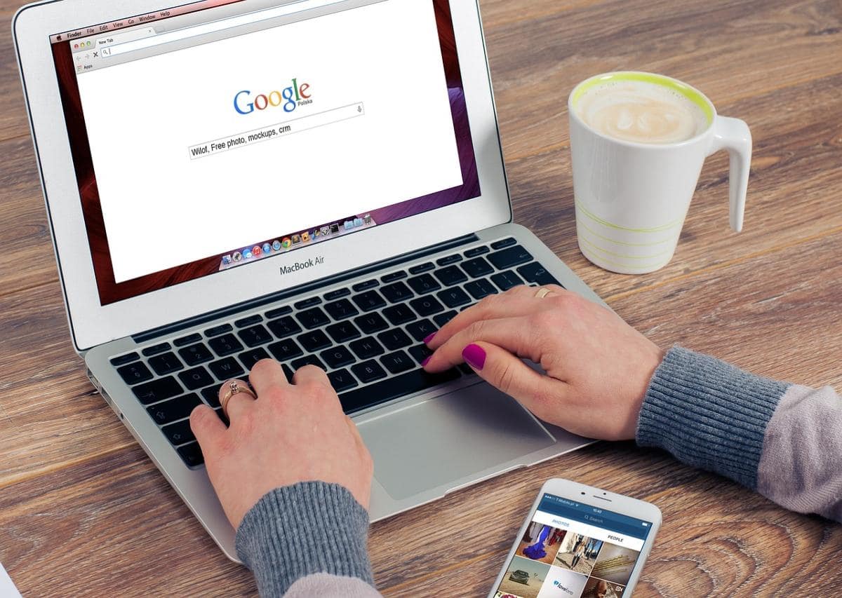 Woman typing queries in Google search bar