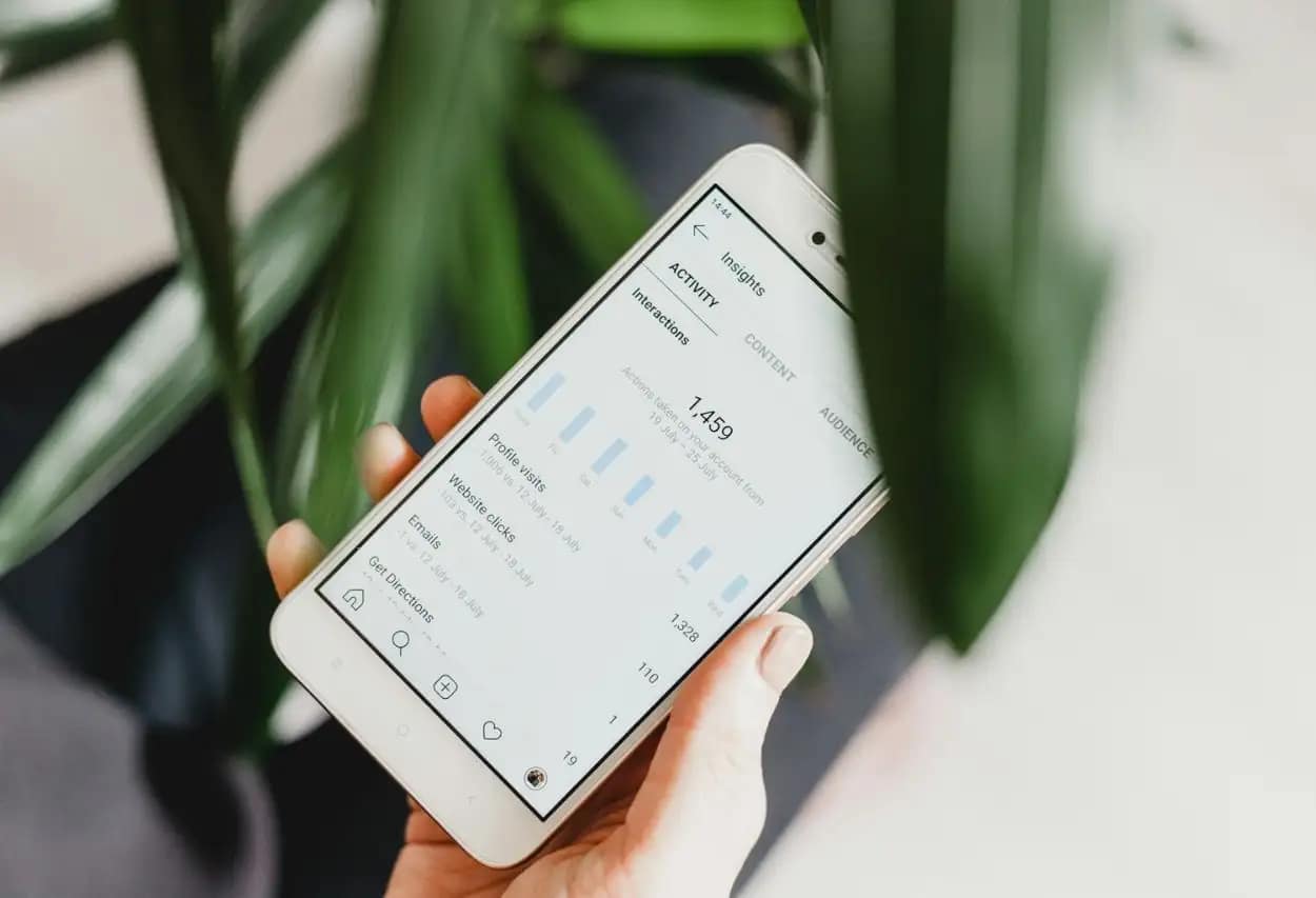 Digital analytics dashboard on smartphone displaying NGO SEO metrics