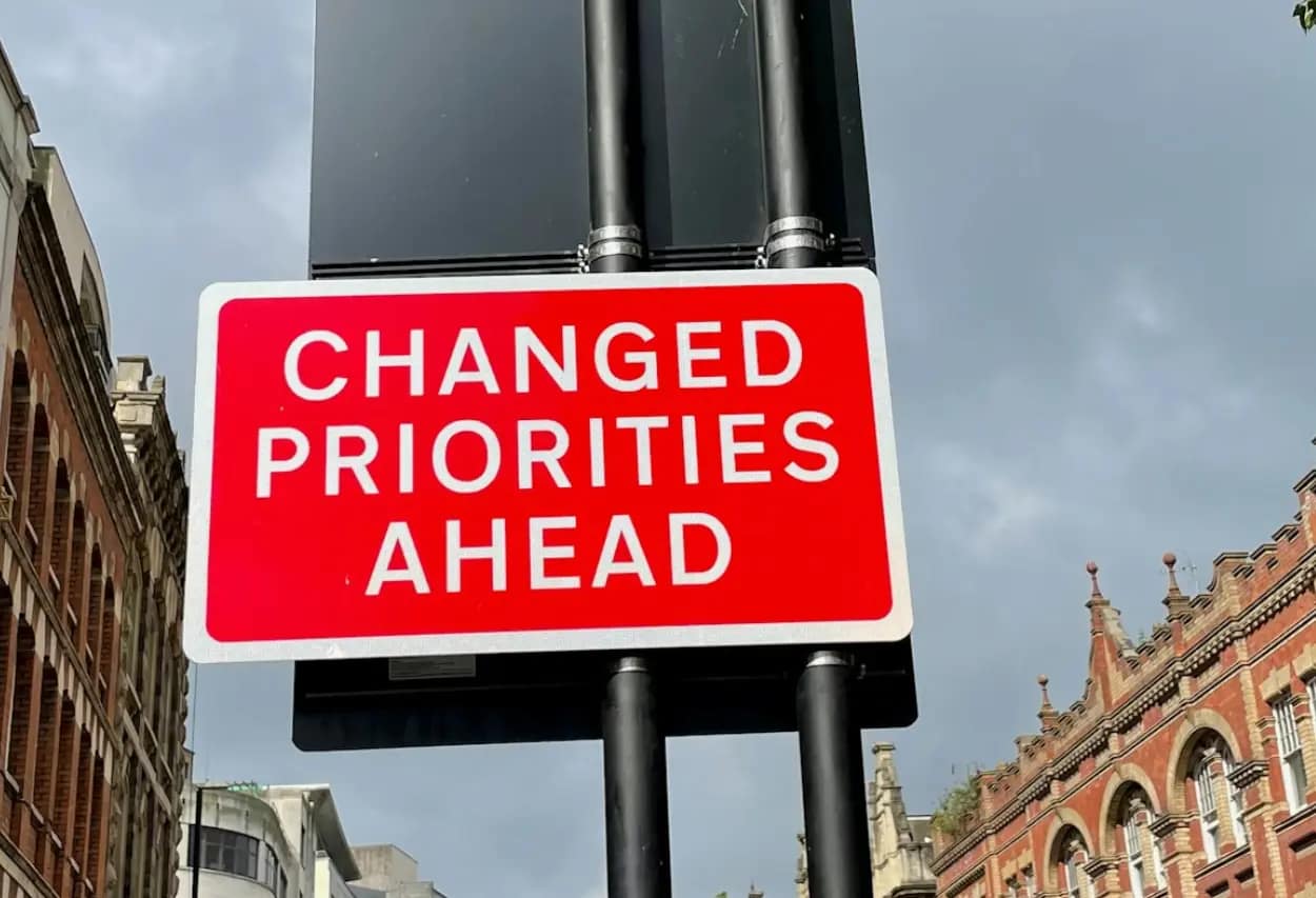 Red traffic sign that says "changed priorities ahead" used as a funny way to illustrate technical seo topic