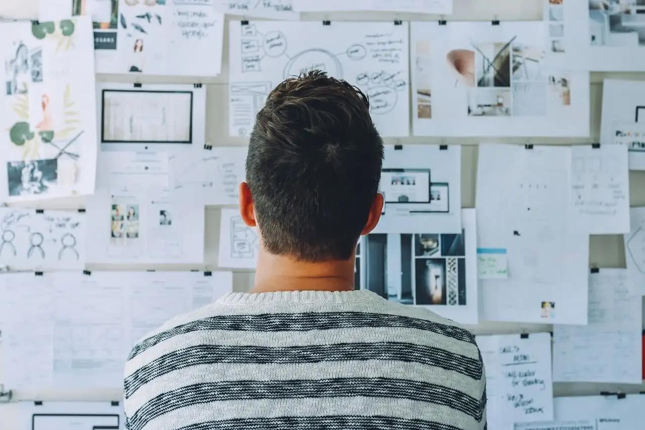 Young green startup founder thinking about effective SEO and digital marketing strategies