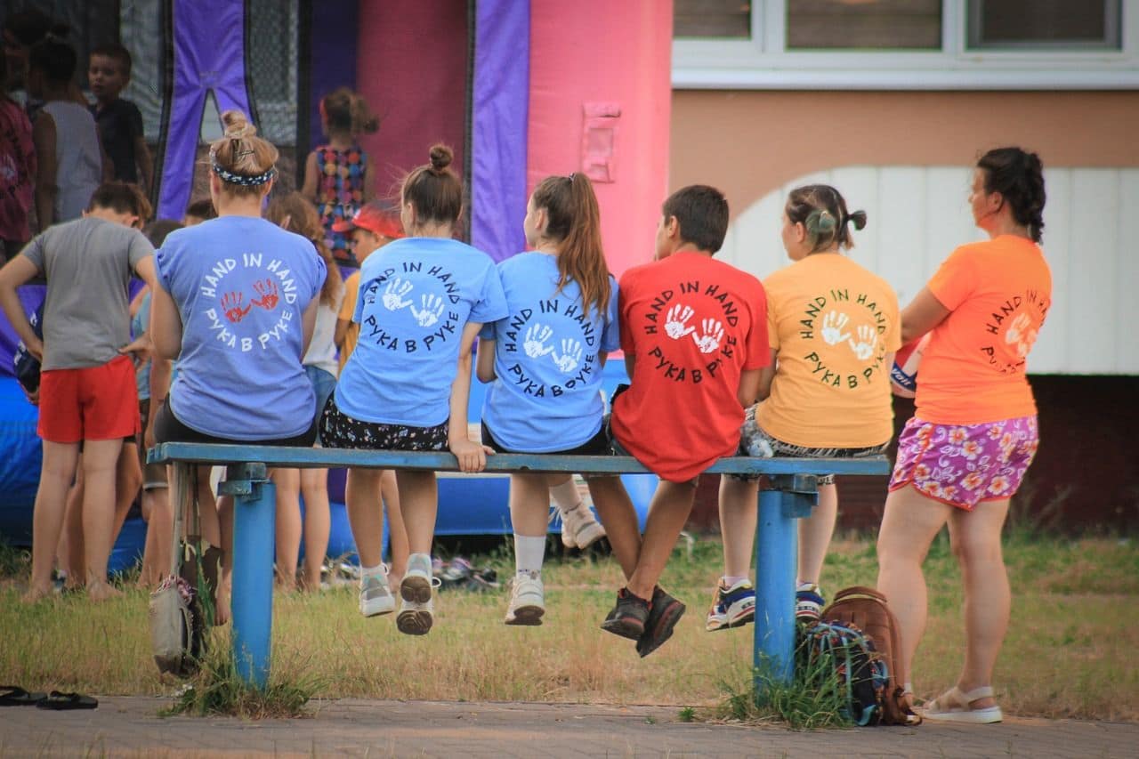 Young NGO volunteers having a break after had day of work