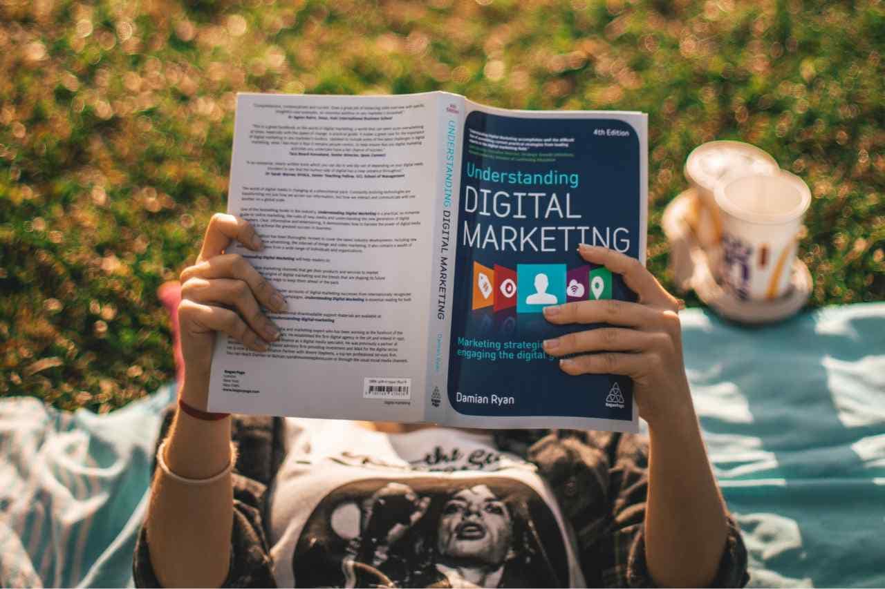 Gradulate student reading about strategies for sustainable digital marketing