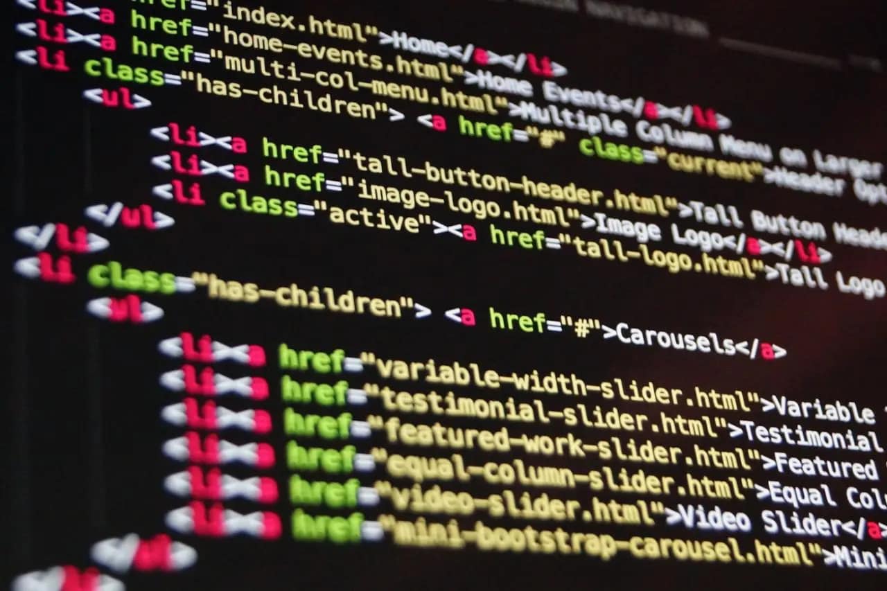 Close-up of HTML code on a monitor screen emphasizing accessibility tags for inclusive web design