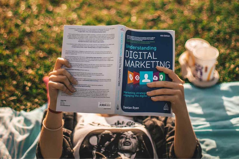 Gradulate student reading about strategies for sustainable digital marketing